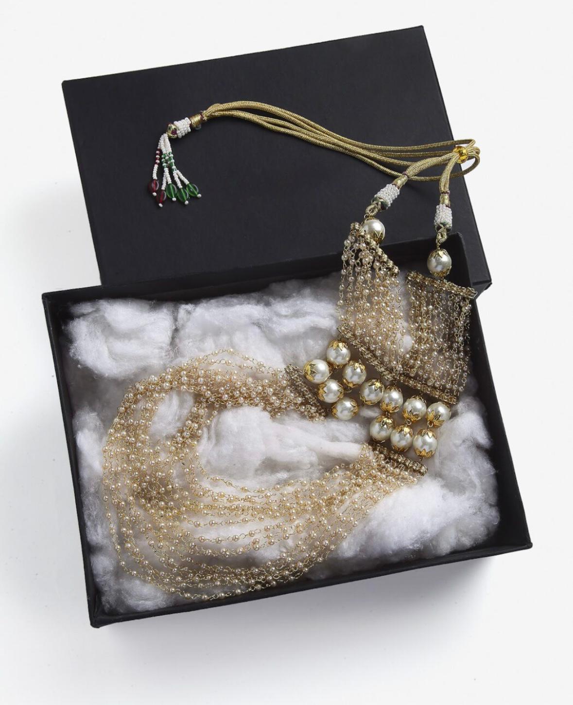 Gold plated necklace with beaded strings, stone embellished & tassel string.